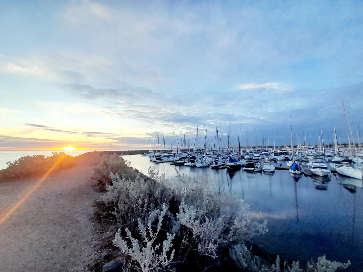 Sunset over yachts moored in Sandringham Yacht Club marina