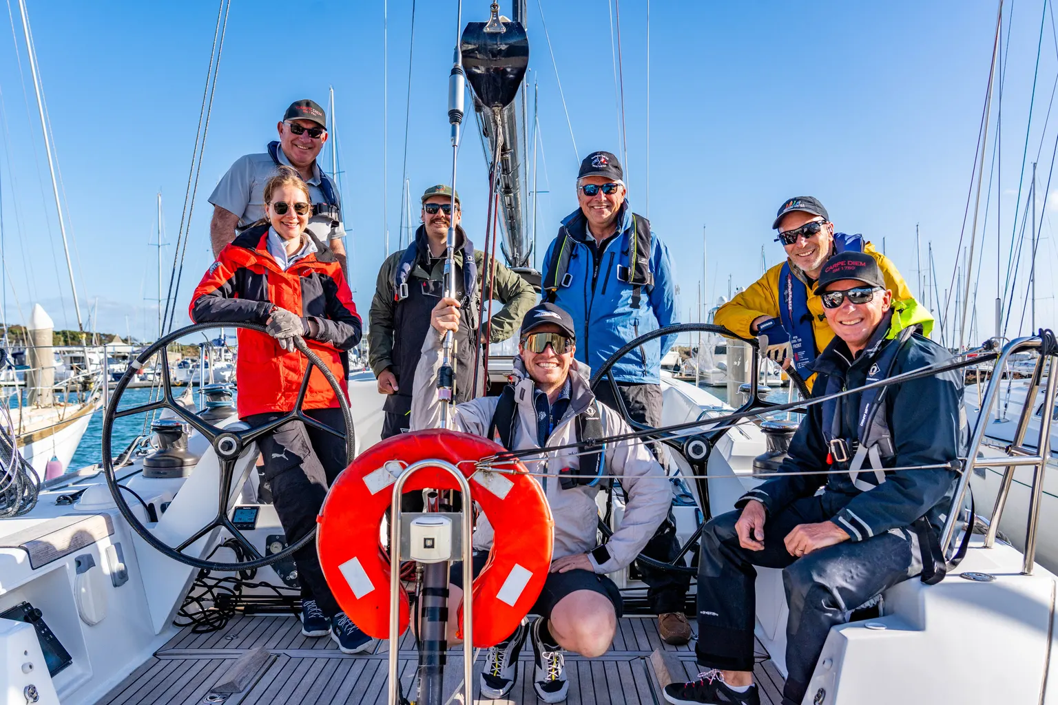 Sailing crew gathered aboard a yacht at Sandringham Yacht Club